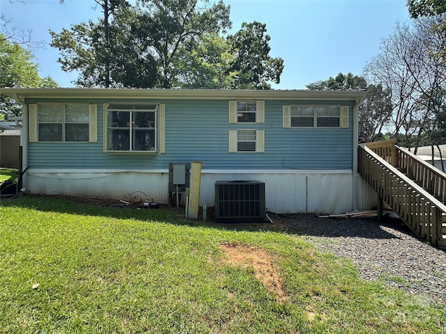 104 Pine St Unit 201, New London, NC 28127 - rear view of property with stairs and a yard