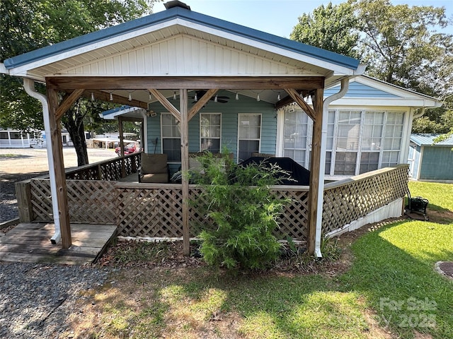 104 Pine St Unit 201, New London, NC 28127 - covered porch featuring a lawn and a sunroom