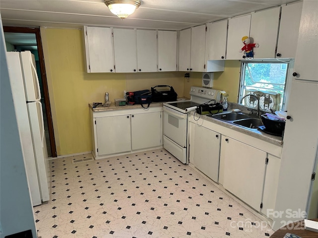 3036 Holly Hill Rd, Hendersonville, NC 28792 - kitchen with white appliances, light countertops, and light floors