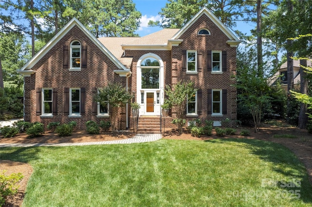 19245 Stableford Ln, Cornelius, NC 28031 - view of front of home with a front lawn and brick siding