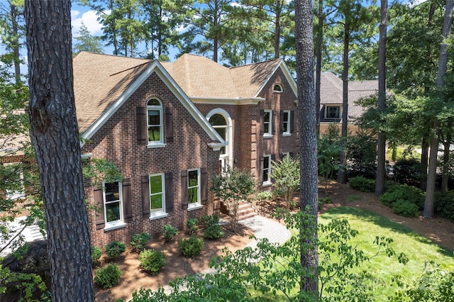19245 Stableford Ln, Cornelius, NC 28031 - view of front of home featuring brick siding and a shingled roof