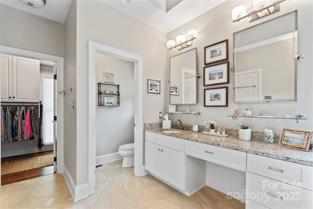 19245 Stableford Ln, Cornelius, NC 28031 - bathroom featuring vanity and a walk in closet