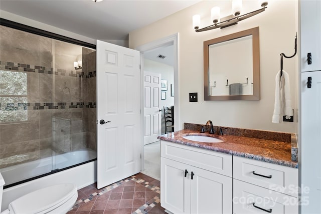 19245 Stableford Ln, Cornelius, NC 28031 - bathroom with vanity, inlaid floor details, bath / shower combo with glass door, and tile patterned floors