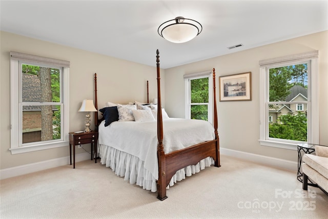 19245 Stableford Ln, Cornelius, NC 28031 - bedroom with light carpet and multiple windows