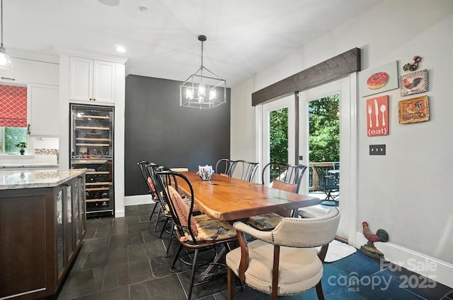 5005 Craftsman Ridge Dr, Matthews, NC 28104 - dining area with beverage cooler, a chandelier, and recessed lighting