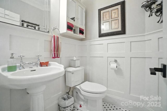 5005 Craftsman Ridge Dr, Matthews, NC 28104 - bathroom with a decorative wall and a wainscoted wall