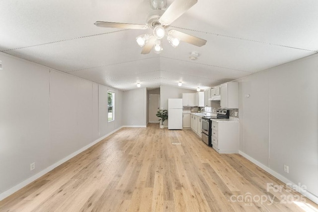 1354 Springwood Ln, Rock Hill, SC 29730 - kitchen with electric stove, freestanding refrigerator, vaulted ceiling, light countertops, and light wood finished floors