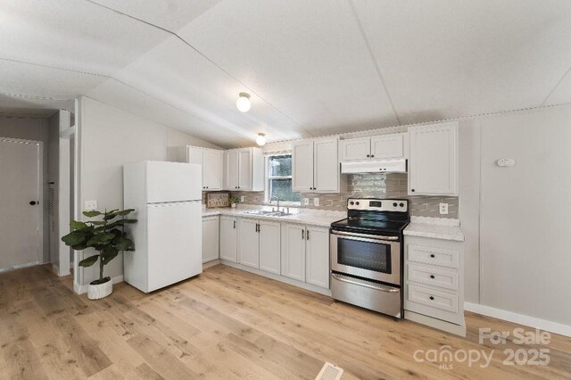 1354 Springwood Ln, Rock Hill, SC 29730 - kitchen featuring freestanding refrigerator, stainless steel electric stove, under cabinet range hood, light countertops, and light wood-type flooring