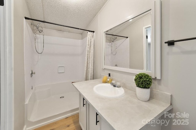 1354 Springwood Ln, Rock Hill, SC 29730 - full bath with curtained shower, vanity, a textured ceiling, and wood finished floors