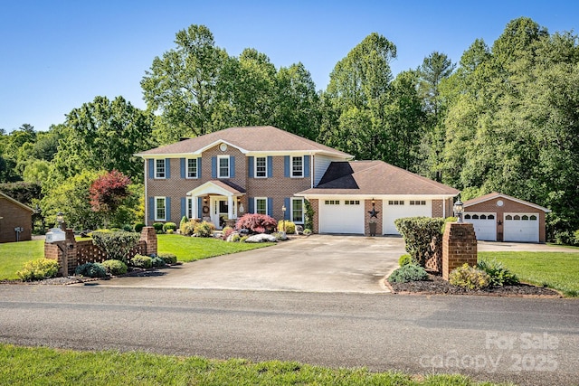 302 Redwood Pl, Lenoir, NC 28645 - colonial home featuring a front yard, an attached garage, driveway, and brick siding