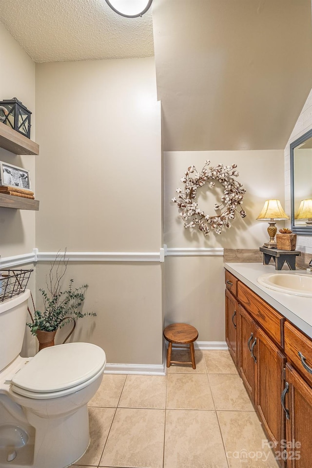 302 Redwood Pl, Lenoir, NC 28645 - bathroom featuring vanity, tile patterned floors, and a textured ceiling
