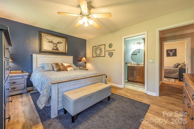 302 Redwood Pl, Lenoir, NC 28645 - bedroom featuring light wood finished floors, a ceiling fan, and connected bathroom