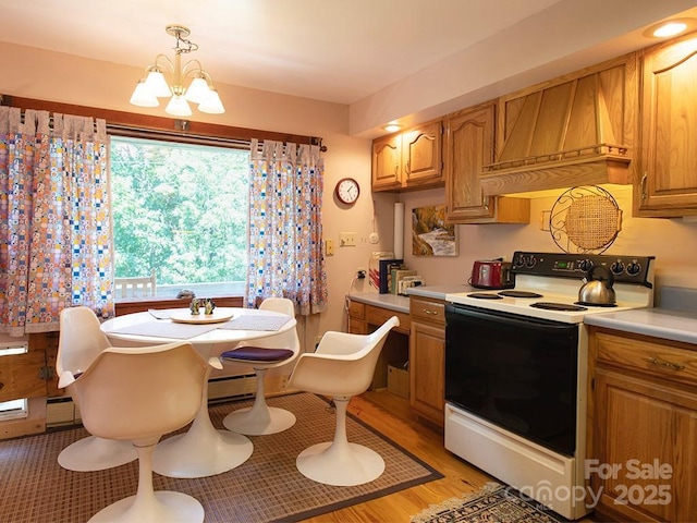 1090 Woolyshot Branch Rd, Hot Springs, NC 28743 - kitchen featuring electric stove, custom exhaust hood, light countertops, a chandelier, and brown cabinets