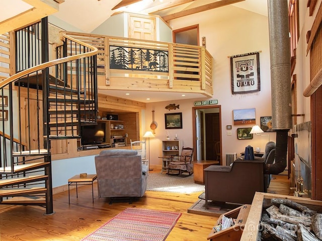 1090 Woolyshot Branch Rd, Hot Springs, NC 28743 - living area featuring wood finished floors, stairway, and high vaulted ceiling