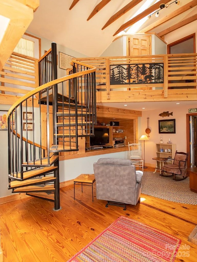 1090 Woolyshot Branch Rd, Hot Springs, NC 28743 - living room with wood finished floors, high vaulted ceiling, and stairs