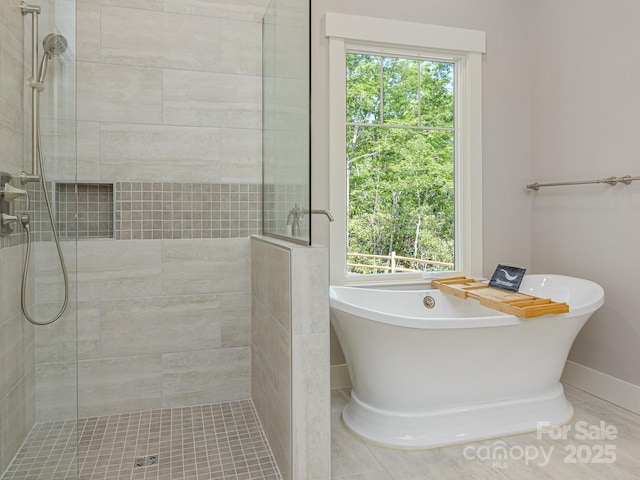 62 Sharp Rd W, Black Mountain, NC 28711 - bathroom featuring a freestanding bath, a tile shower, and tile patterned floors