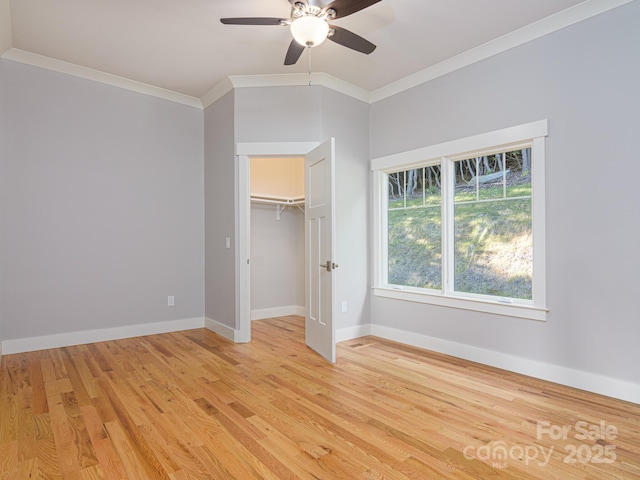 62 Sharp Rd W, Black Mountain, NC 28711 - unfurnished bedroom with ornamental molding, light wood-type flooring, a ceiling fan, and a closet