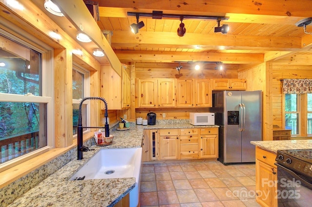 178 Anglers Way, Lake Lure, NC 28746 - kitchen with stainless steel fridge with ice dispenser, white microwave, black electric range oven, light brown cabinetry, and a wood ceiling with exposed beams