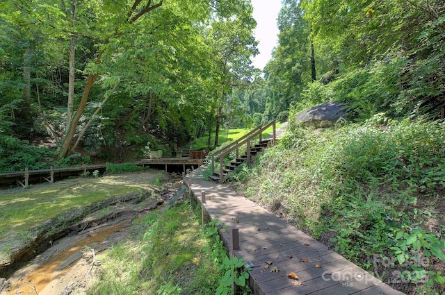 178 Anglers Way, Lake Lure, NC 28746 - view of yard featuring stairway, a forest view, and a deck