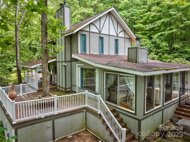 1504 Red Marble Rd, Andrews, NC 28901 - back of property with a chimney, stairway, a wooden deck, roof with shingles, and stucco siding