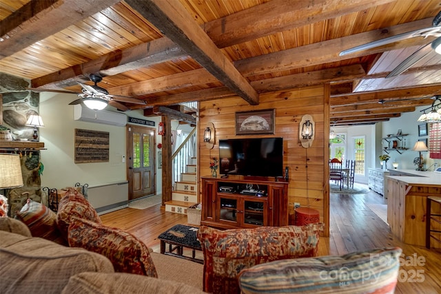 1504 Red Marble Rd, Andrews, NC 28901 - living area with ceiling fan, wood-type flooring, a wood ceiling with exposed beams, wood walls, and healthy amount of natural light