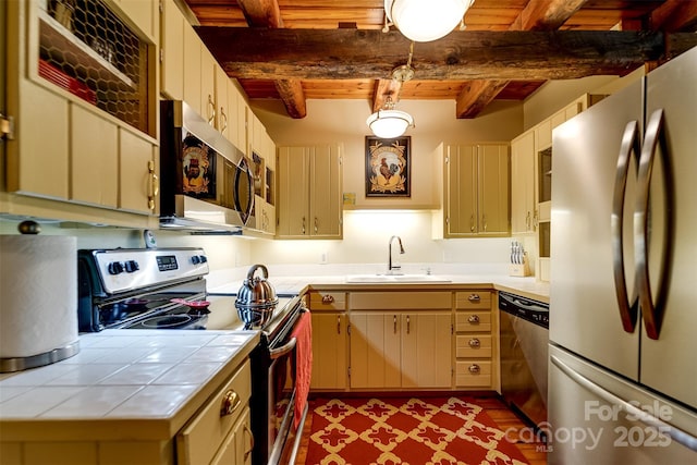 1504 Red Marble Rd, Andrews, NC 28901 - kitchen featuring stainless steel appliances, tile countertops, a wood ceiling with exposed beams, and wood finished floors