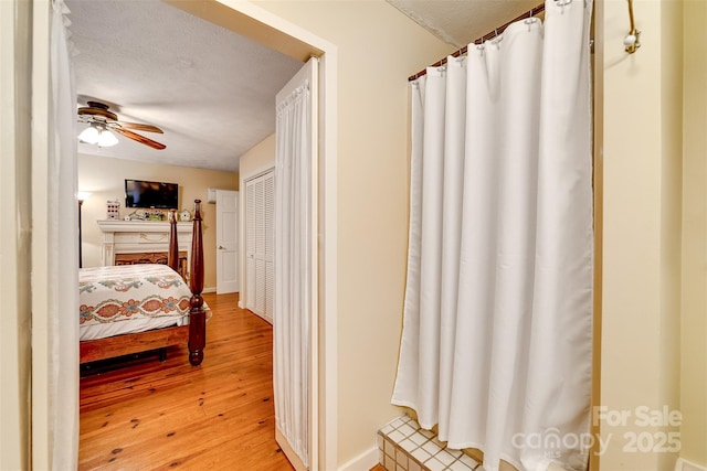 1504 Red Marble Rd, Andrews, NC 28901 - bedroom featuring light wood finished floors, a textured ceiling, and ceiling fan