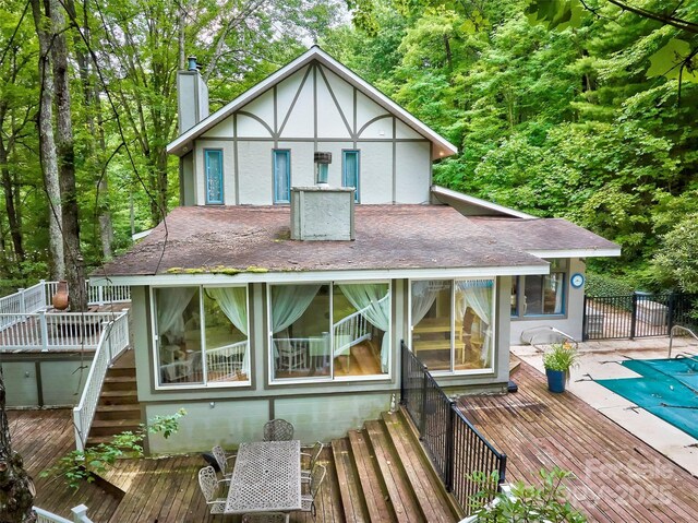 1504 Red Marble Rd, Andrews, NC 28901 - back of property featuring a deck, a chimney, stairway, and a shingled roof
