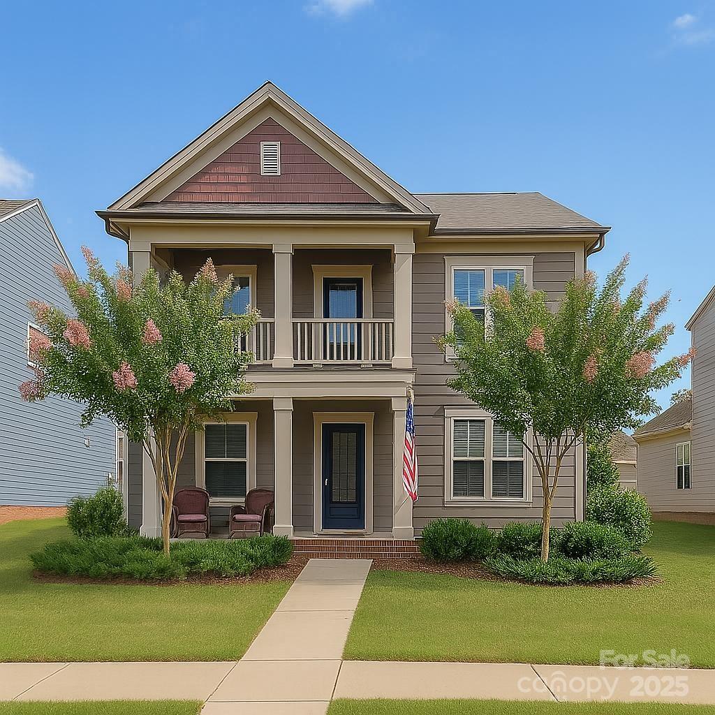 4004 Silverwood Dr, Waxhaw, NC 28173 - view of front facade with a porch, a balcony, and a front yard