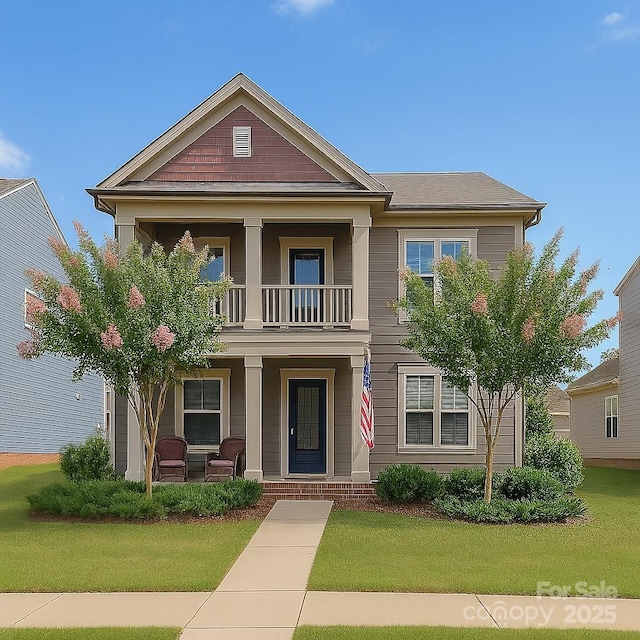 4004 Silverwood Dr, Waxhaw, NC 28173 - view of front facade with a porch, a balcony, and a front yard