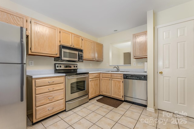1250 Maple Shade Ln, Charlotte, NC 28270 - kitchen featuring appliances with stainless steel finishes, light brown cabinets, light countertops, and light tile patterned flooring