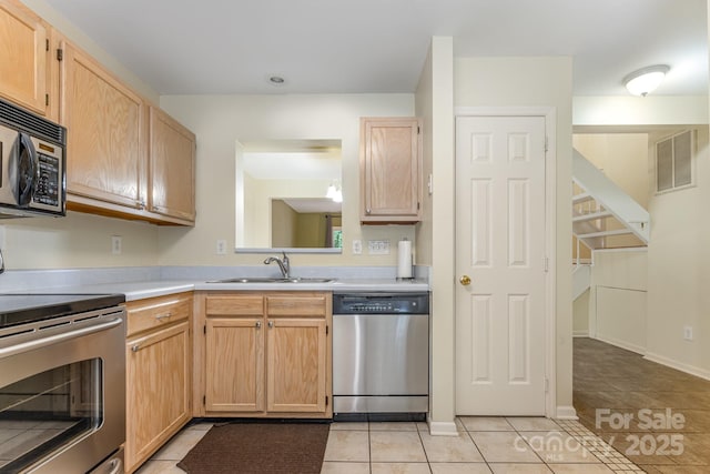 1250 Maple Shade Ln, Charlotte, NC 28270 - kitchen with appliances with stainless steel finishes, light brown cabinetry, and light countertops