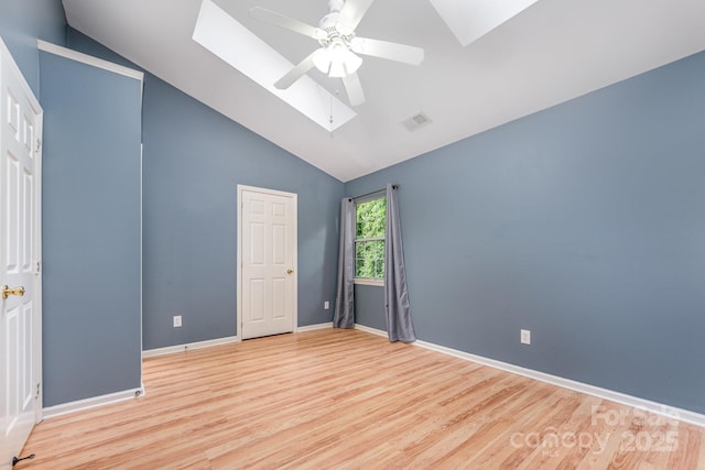 1250 Maple Shade Ln, Charlotte, NC 28270 - unfurnished bedroom featuring a skylight, wood finished floors, a ceiling fan, and high vaulted ceiling