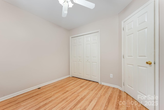 1250 Maple Shade Ln, Charlotte, NC 28270 - unfurnished bedroom with light wood-style floors, a closet, and a ceiling fan