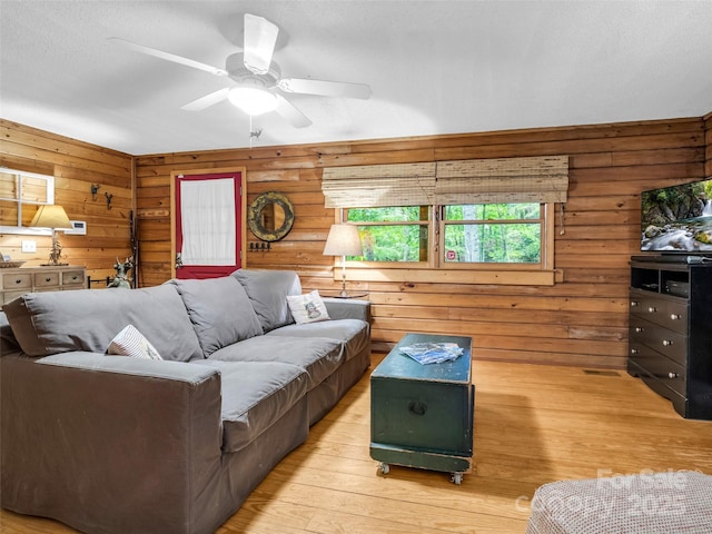 116 Chalet Rd, Lake Lure, NC 28746 - living area featuring light wood finished floors, wood walls, and a ceiling fan