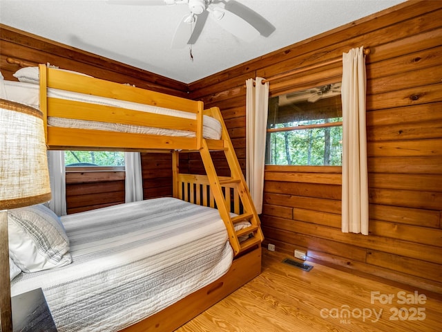 116 Chalet Rd, Lake Lure, NC 28746 - bedroom with multiple windows and wood finished floors