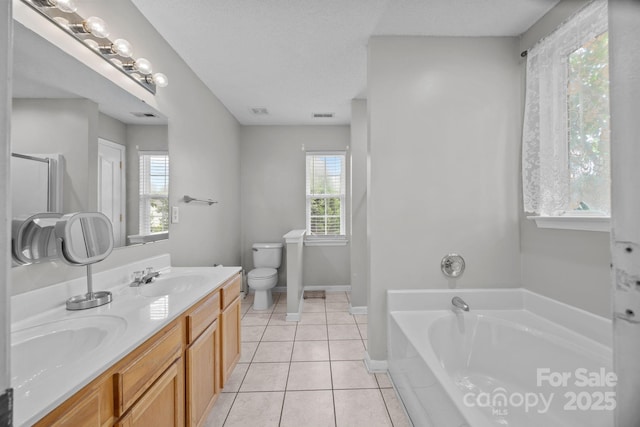 8009 Trotter Rd, Charlotte, NC 28216 - bathroom featuring a garden tub, double vanity, and tile patterned flooring