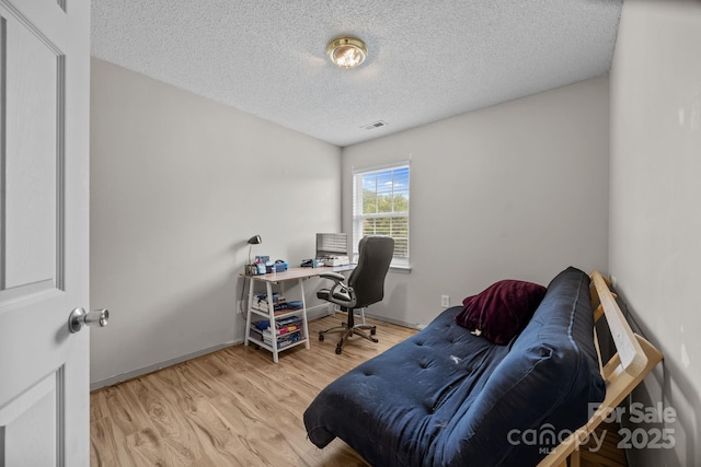 8009 Trotter Rd, Charlotte, NC 28216 - office area with a textured ceiling and wood finished floors