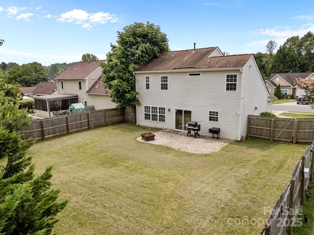 8009 Trotter Rd, Charlotte, NC 28216 - rear view of property featuring a fire pit, a patio area, and a fenced backyard
