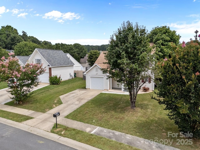 8009 Trotter Rd, Charlotte, NC 28216 - view of front of house featuring driveway, a front yard, and a garage