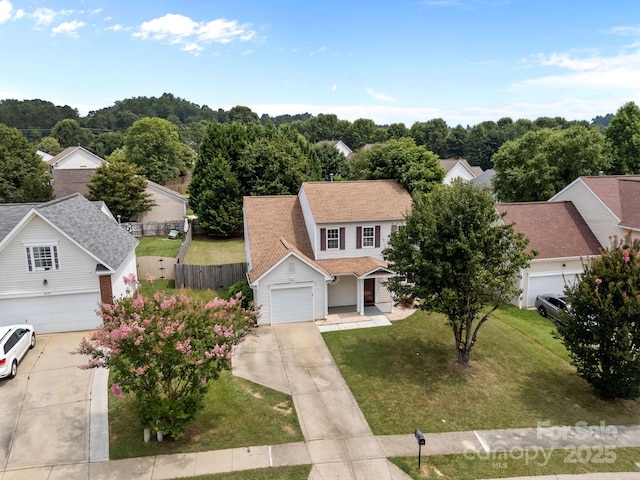 8009 Trotter Rd, Charlotte, NC 28216 - view of front of property with a garage, driveway, and a residential view