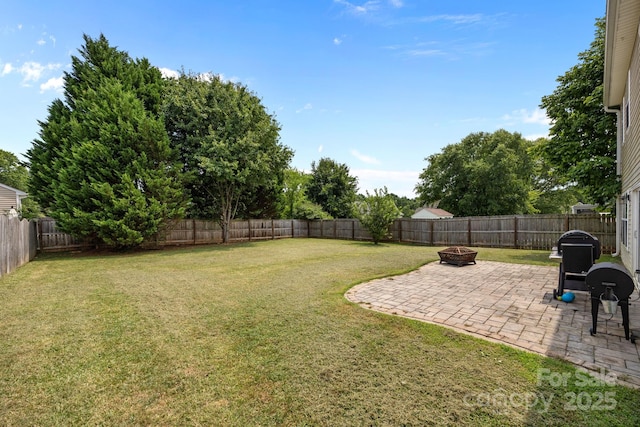 8009 Trotter Rd, Charlotte, NC 28216 - fenced backyard with an outdoor fire pit and a patio area