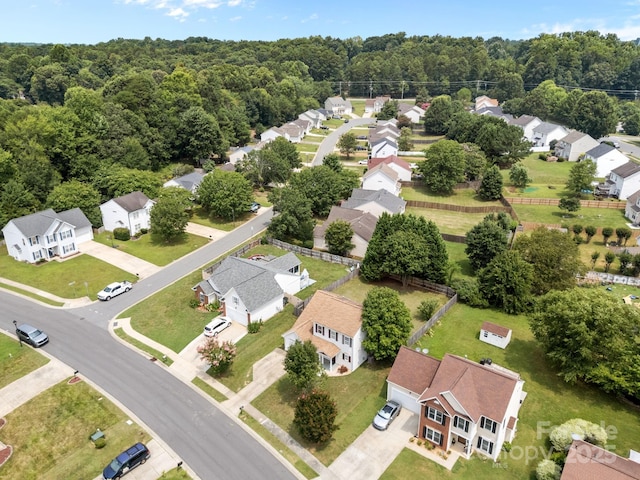 8009 Trotter Rd, Charlotte, NC 28216 - aerial perspective of suburban area with a heavily wooded area