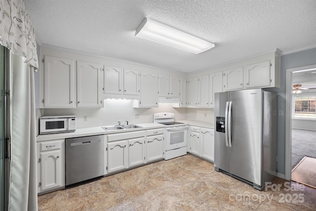 248 Pointe Cir, Rock Hill, SC 29732 - kitchen with appliances with stainless steel finishes, a textured ceiling, white cabinets, light countertops, and crown molding