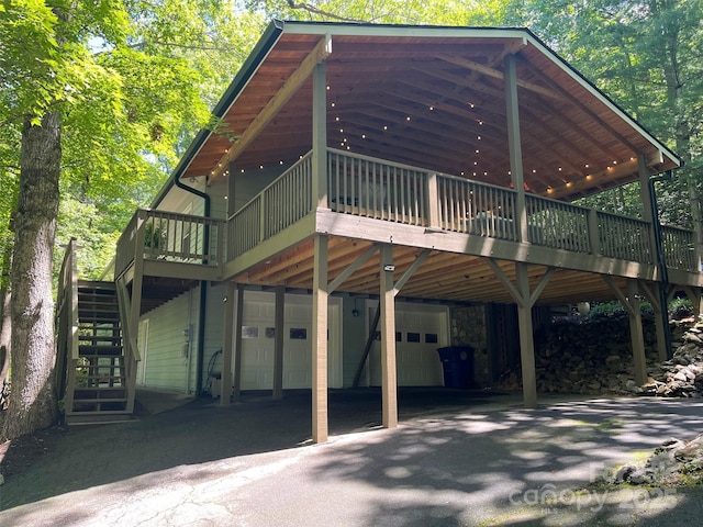 27 Walker Cove Rd, Black Mountain, NC 28711 - rear view of property featuring stairway, a garage, a deck, and driveway