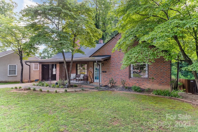 57 Patton Ct SE, Concord, NC 28025 - view of front facade featuring brick siding and a chimney