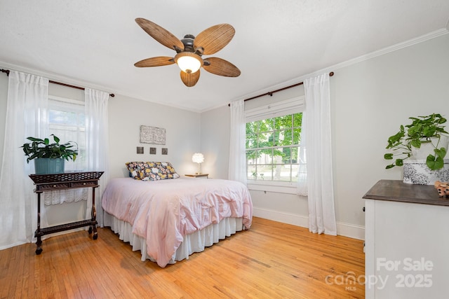 57 Patton Ct SE, Concord, NC 28025 - bedroom with crown molding, light wood-style flooring, and ceiling fan
