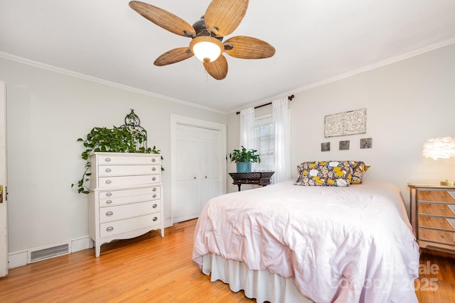 57 Patton Ct SE, Concord, NC 28025 - bedroom with ornamental molding, light wood-style floors, a ceiling fan, and a closet
