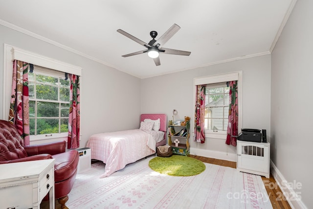 57 Patton Ct SE, Concord, NC 28025 - bedroom with wood finished floors, ornamental molding, and a ceiling fan