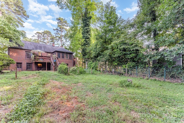 57 Patton Ct SE, Concord, NC 28025 - view of yard featuring stairway and a wooden deck